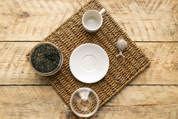 Tea set on the wooden background  top view