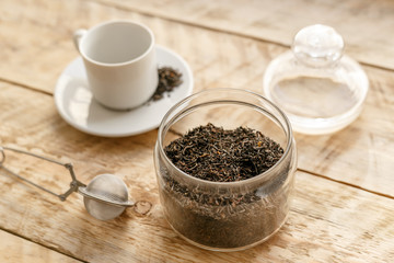Tea set on the wooden table at sunny morning