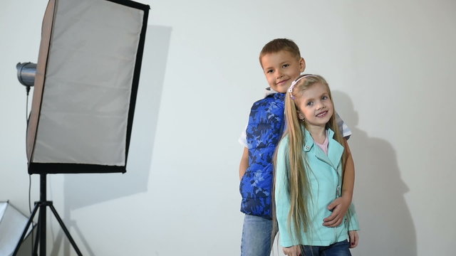 Photographer taking pictures of the child in the studio.