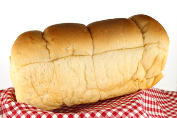 loaf of bread on tablecloth