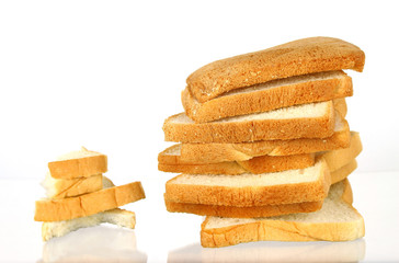 The cut loaf of bread with reflection isolated on white