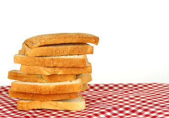 loaf of bread on tablecloth