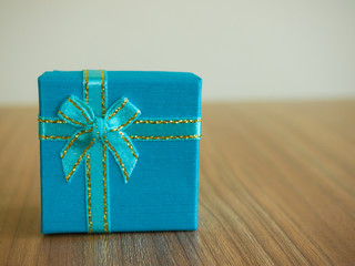Blue Gift box on the wooden background