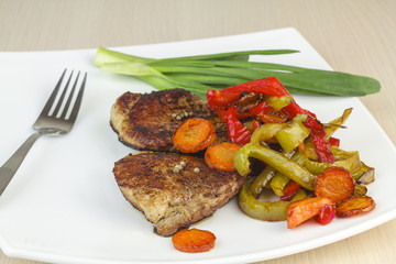 Fried meat with vegetables.