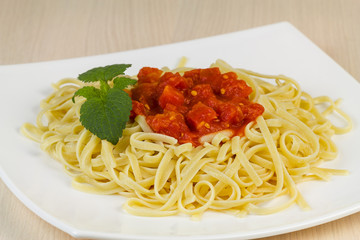 Spaghetti with tomato sauce.