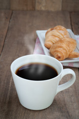 dining table with hot coffee cup.