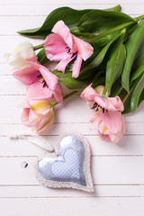Pink  tulips and decorative heart