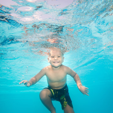 Boy swims underwater