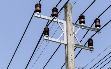 Electricity line and cup on blue sky background.
