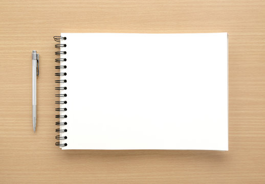 White Notebook Paper With Pen On Wood