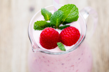 Raspberry milk shake with mint decor.