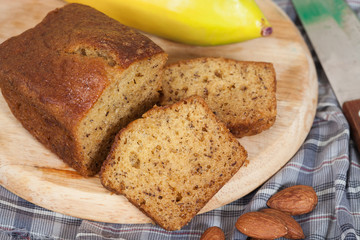 Homemade banana bread sliced on a table . rustic style