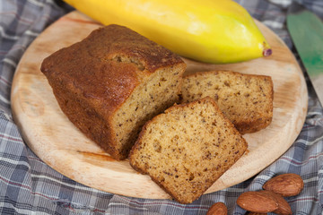 Homemade banana bread sliced on a table . rustic style