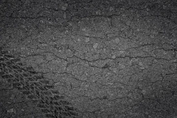 Obraz premium Wheel track asphalt broken of background texture