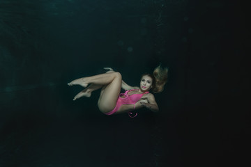 Woman under water.