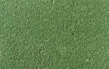 Green painted asphalt background and texture.