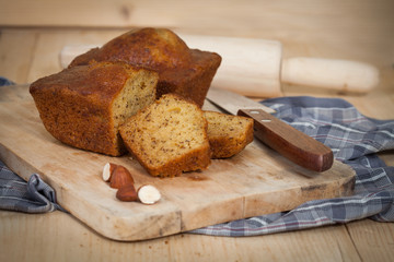 Homemade banana bread sliced on a table . rustic style