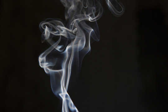 White smoke on isolated dark background