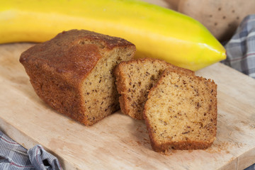 Homemade banana bread sliced on a table . rustic style
