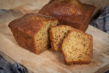 Homemade banana bread sliced on a table . rustic style