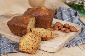 Homemade banana bread sliced on a table . rustic style