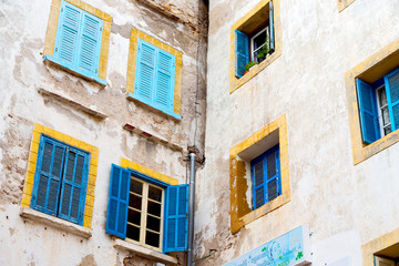 Fototapeta na wymiar blue window in morocco africa old construction and brown wall c