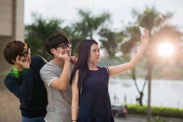 Teens making faces when photographing outdoors