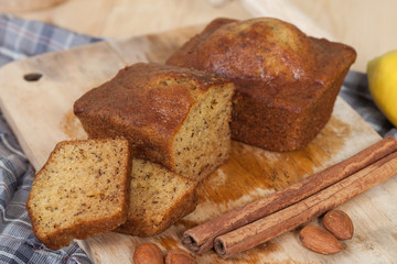 Homemade banana bread sliced on a table . rustic style