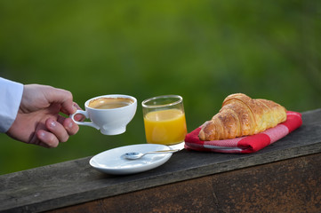 Breakfast coffee, orange juice and croissant
