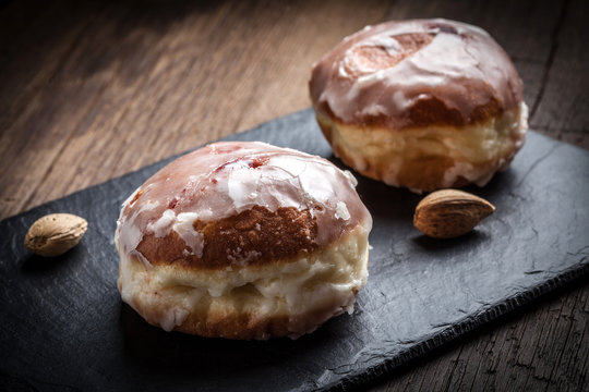 Donut with icing and rose jam.