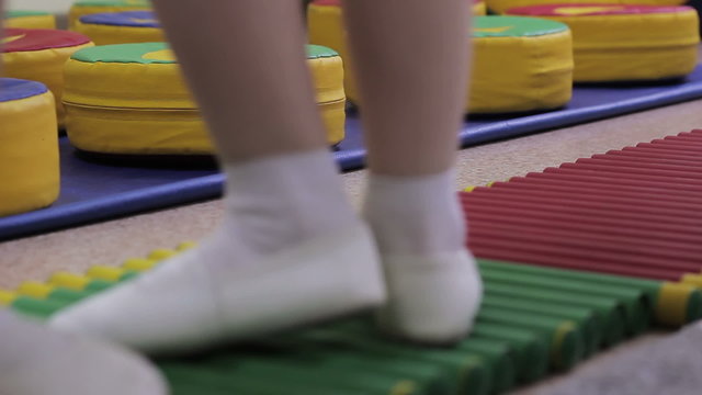 Children in kindergarten are engaged in a sports hall