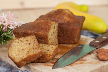 Homemade banana bread sliced on a table . rustic style