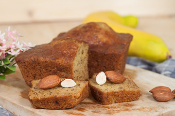 Homemade banana bread sliced on a table . rustic style