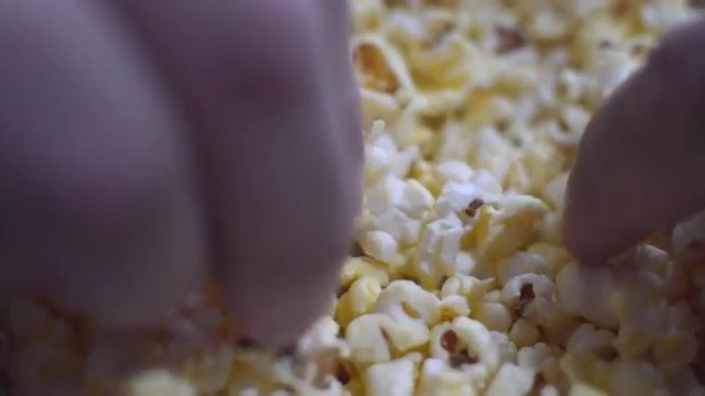 Close-Overs Popcorn. People Take His Hands