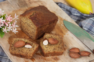 Homemade banana bread sliced on a table . rustic style