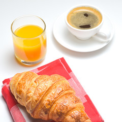 Breakfast coffee, orange juice and croissant