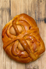 portuguese traditional Easter cake Folar on brown wooden background