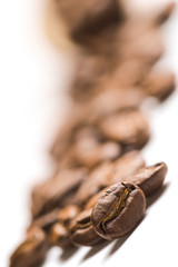 Brown coffee beans isolated on white