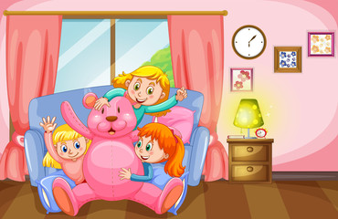 Obraz na płótnie Canvas Three girls and pink teddy bear in living room
