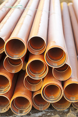 new red plastic water pipes construction site