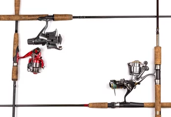 Fotobehang frame from fishing rods and reels © sytnik