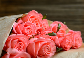 Close up on roses over wooden table