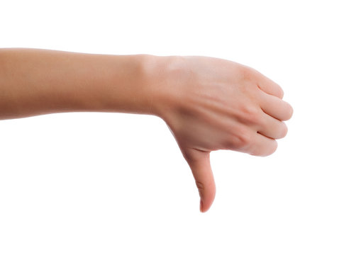 Hand making a thumbs down gesture. Image of human hand showing thumb down in isolation