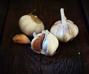 heads of garlic on a wooden background
