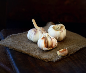 heads of garlic on a wooden background
