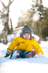 Fototapeta na wymiar Funny baby laughing outdoors in winter day