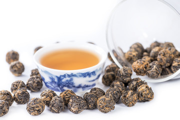 close-up of Tea black dragon pearl tea, brewed tea into a bowl,