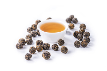 Fototapeta na wymiar close-up of Tea black dragon pearl tea, brewed tea into a bowl,