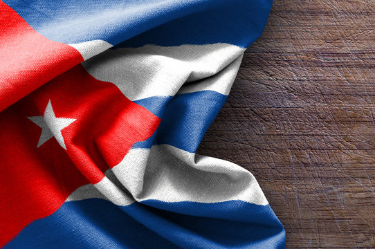 Flag of Cuba on wood background