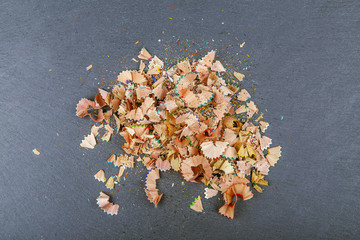 Background of multicolor pencil shavings.